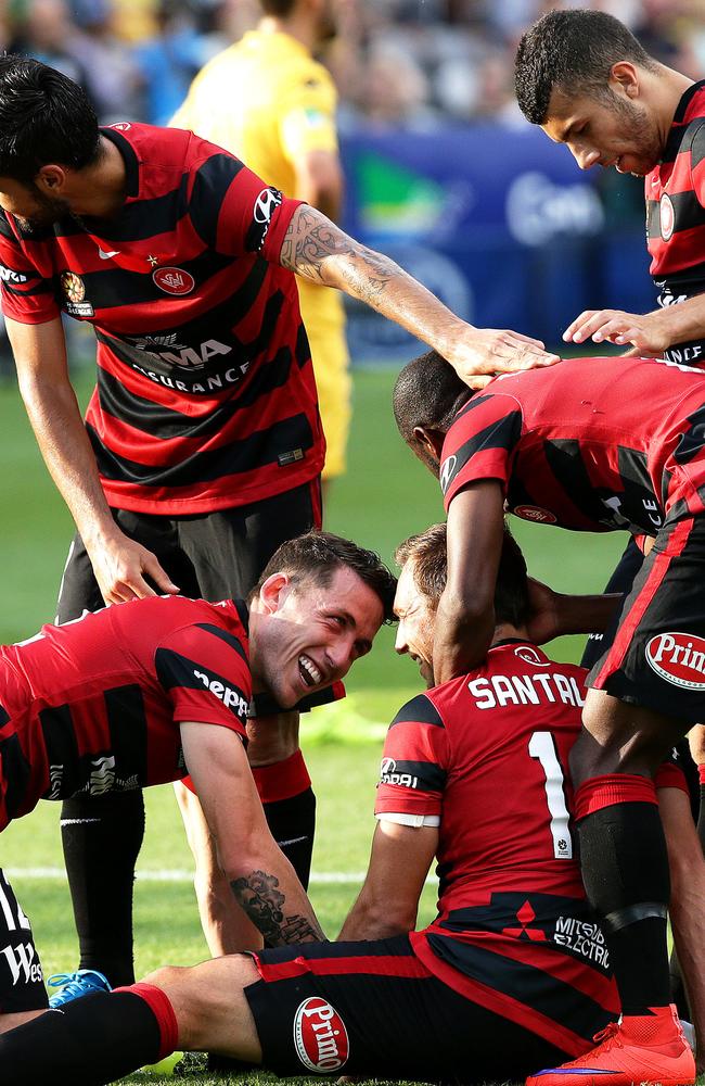 Brendon Santalab is mobbed by teammates. Picture: Peter Lorimer.