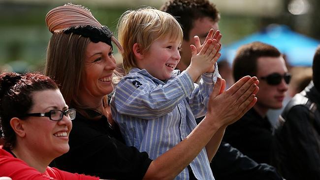 Trish Oliver and son Luke applaud after Damien Oliver wins on Divine Calling last month. Picture: Colleen Petch