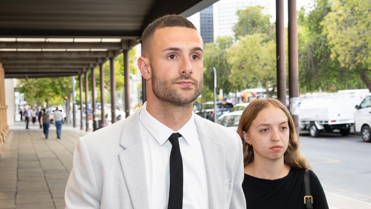 Tyler Ford leaving court with a supporter after sentencing submissions for cocaine dealing. Picture: NewsWire / Tim Joy