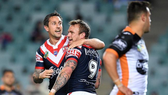 Mitchell Pearce of the Roosters, (left), celebrates with Jake Friend after scoring a try during the Round 24 NRL match between the Sydney Roosters and the Wests Tigers at Allianz Stadium in Sydney, Saturday, August 19, 2017. (AAP Image/Dan Himbrechts) NO ARCHIVING, EDITORIAL USE ONLY