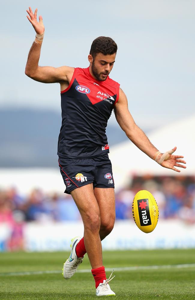 Christian Salem kicks during the NAB Challenge match against the Western Bulldogs. Picture: Getty