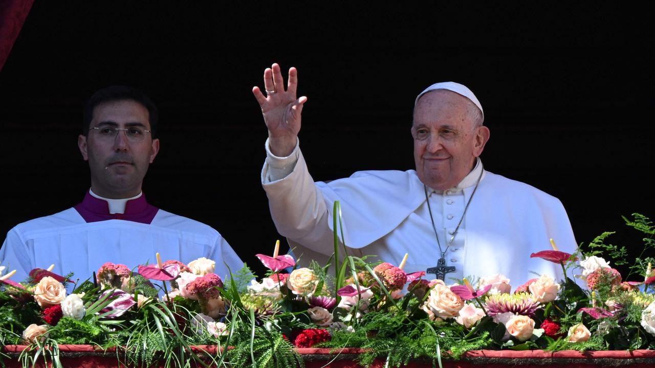 Pope Francis waves from the loggia of St. Peter's basilica after delivering the Urbi et Orbi message and blessing for Easter on April 9, 2023 in The Vatican. Picture: AFP.