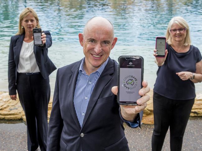 Federal MPs, Angie Bell, Stuart Robert and Karen Andrews holding up the COVIDSAFE App.  Picture: Jerad Williams