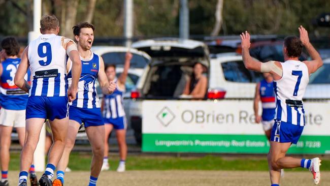 Langwarrin's Charlie Meggs (No 7) celebrates with teammates. Picture: Paul Churcher