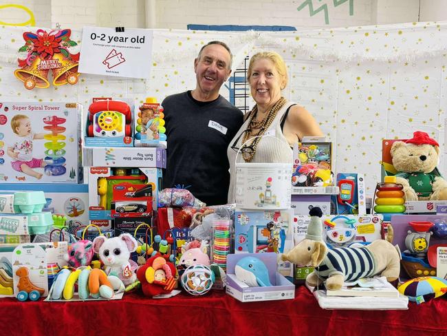 Hobart City Mission volunteers David Wilkinson and Janet Wilkinson with the many toys donated. Picture: Supplied.