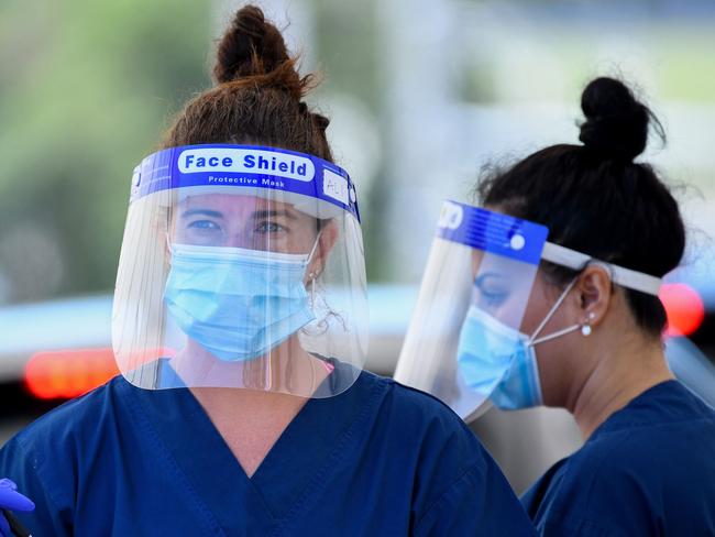 SYDNEY, AUSTRALIA - NewsWire Photos FEBRUARY, 22, 2021: NSW Health workers dressed in Personal Protection equipment (PPE) are seen at the St Vincents Hospital COVID-19 drive through testing clinic at Bondi Beach, Sydney. Australia has begun its Pfizer COVID-19 vaccination rollout this morning, with hopes 60,000 doses will be administered by the end of the week. NCA NewsWire/Bianca De Marchi