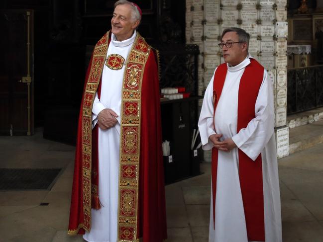 Notre-Dame de Paris cathedral's rector Patrick Chauvet, right, and auxiliary bishop of Paris Philippe Marsset attend the Way of the Cross ceremony. Picture: AP