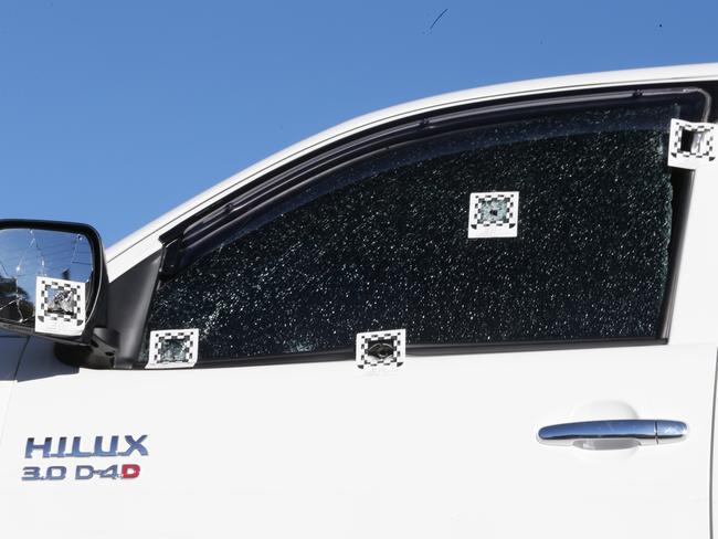 Gunshots into the window of the Hilux ute.