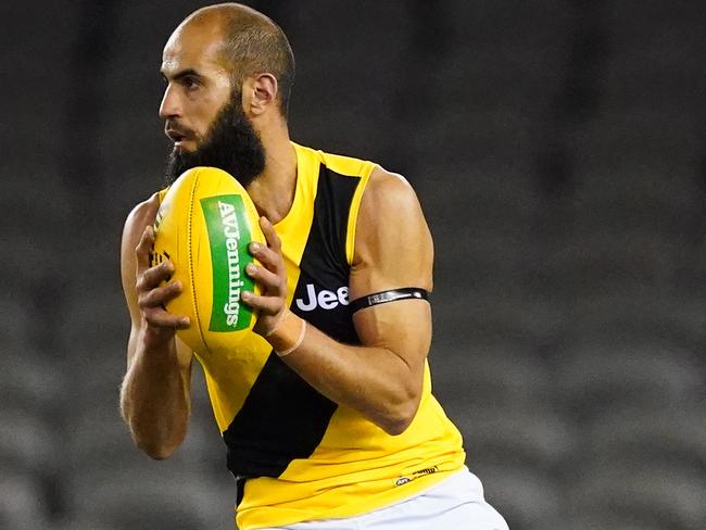 Bachar Houli of the Tigers runs with the ball during the Round 4 AFL match between the St Kilda Saints and the Richmond Tigers at Marvel Stadium in Melbourne, Saturday, June 27, 2020. (AAP Image/Scott Barbour) NO ARCHIVING, EDITORIAL USE ONLY