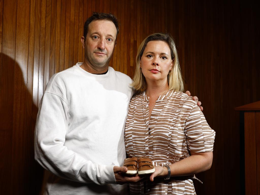 Elouise and Danny Massa holding the shoes of there son Joe who died at Northern Beaches Hospital at the May 15 community forum. Picture: Jonathan Ng