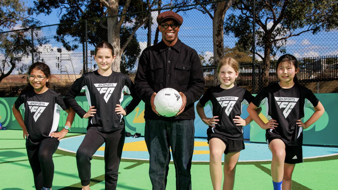 Arsenal legend Ian Wright with Laila Gazar, 10, Acelya Uluc, 10, Ellie Weeks, 10, and Sophia Liwanto, 9. Picture: Justin Lloyd.