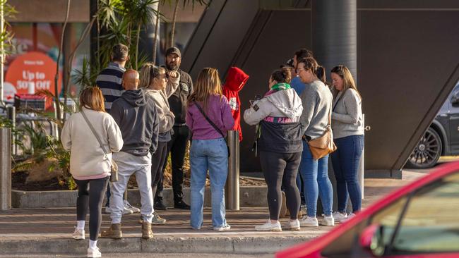 Evacuated shoppers outside. Picture: Ben Clark