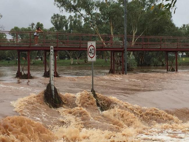 Undoolya Rd flooded by the Todd River flow. PHOTO: Amber Chambers