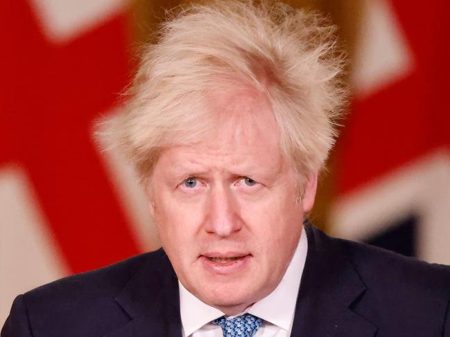 Britain's Prime Minister Boris Johnson speaks during a virtual press conference inside 10 Downing Street in central London on December 21, 2020, after a string of countries banned travellers and all but unaccompanied freight arriving from the UK, due to the rapid spread of a new, more-infectious coronavirus strain. - Countries around the world closed their borders to Britain Monday in a race to contain a fast-spreading variant of the coronavirus as the European Union neared approval of its first jab for the bloc's vaccination campaign. British Prime Minister Boris Johnson held a crisis meeting about the situation Monday, with particular concern about the disruption of goods from France, which imposed a 48-hour blockade on people and lorries crossing the English Channel. (Photo by Tolga Akmen / POOL / AFP)