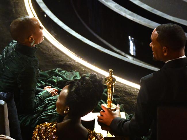 Will Smith with wife Jada Pinkett Smith at the Oscars, where Chris Rock joked about her bald head. Picture: AFP.