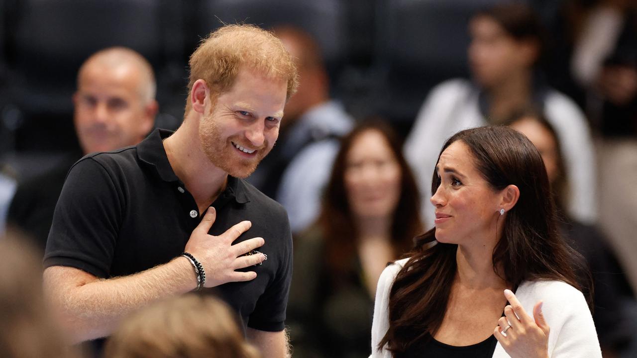 Meghan Markle & Prince Harry laugh with Invictus Games crowds – as ...