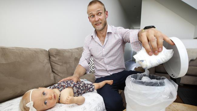 Dr Ian Northeast says he feels more useful since he started doing some night feeds and nappy changes for his daughter Grace. Picture: David Caird