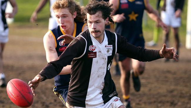 Rhys Fynch of Craigieburn battles with Chase Dawson of Doutta Stars. Picture: Hamish Blair