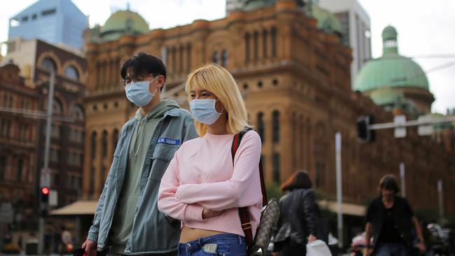 People wearing face masks in Sydney’s CBD. Picture: AAP.