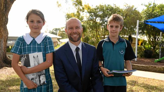 TOP PERFORMER: Cooloola Christian College students Lena Swenson (left) and Riley Kenrick with proud principal Trevor Norman.