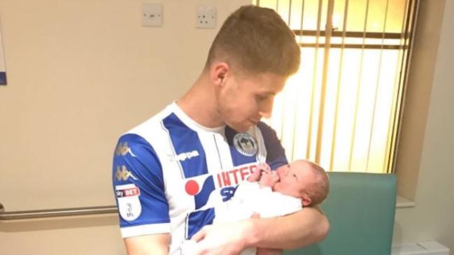 Ryan Colclough arrives at hospital for his son's birth.