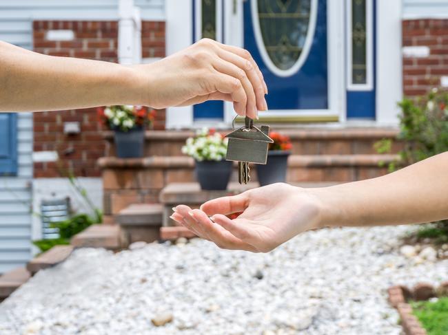 QST property management - generic photo handing over keys to home