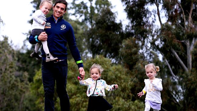 Carrazzo is the father of triplets Grace, Sophia and Charlotte, pictured in 2014. Picture: Tim Carrafa