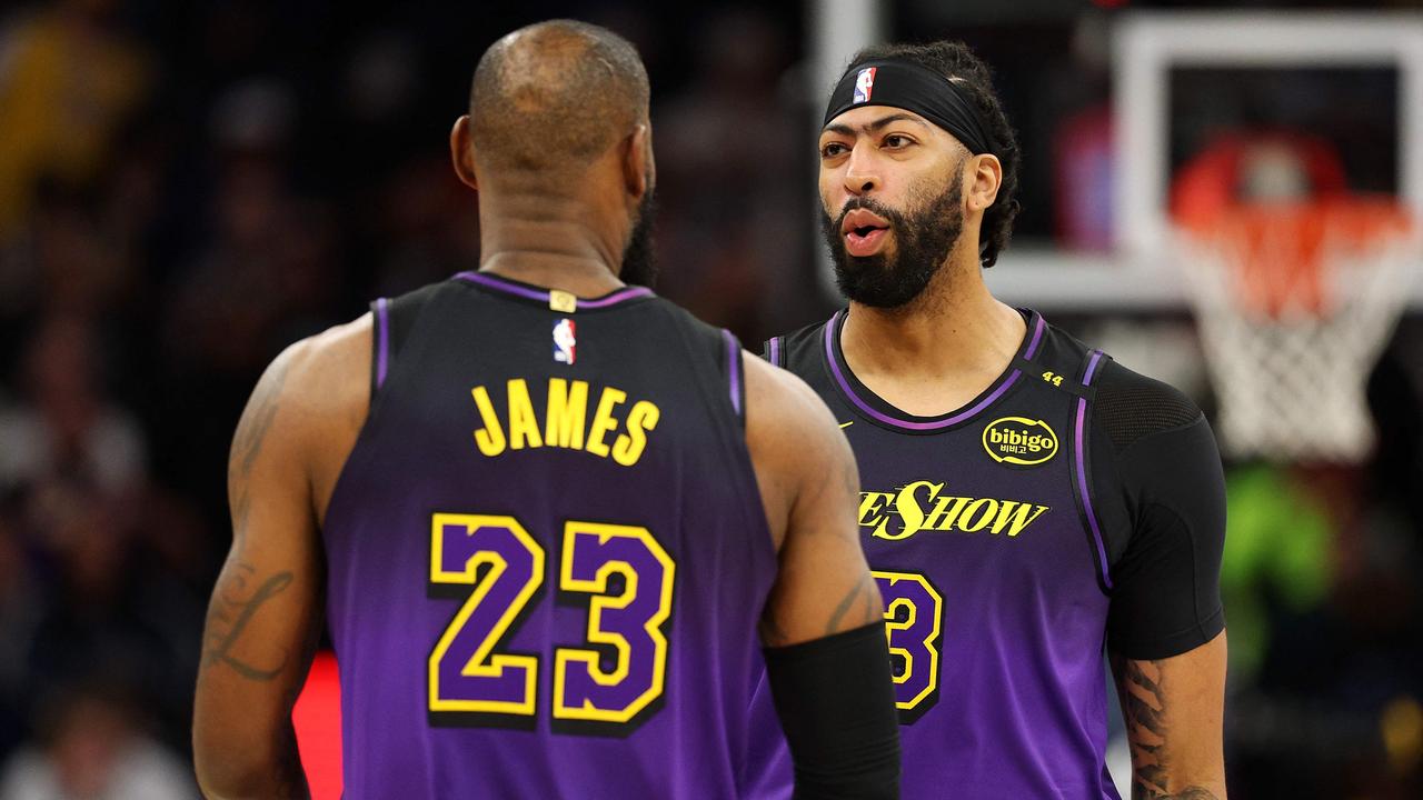 MINNEAPOLIS, MINNESOTA - DECEMBER 02: LeBron James #23 of the Los Angeles Lakers interacts with Anthony Davis #3 prior to the start of the first quarter against the Minnesota Timberwolves at Target Center on December 02, 2024 in Minneapolis, Minnesota. NOTE TO USER: User expressly acknowledges and agrees that, by downloading and or using this photograph, User is consenting to the terms and conditions of the Getty Images License Agreement. David Berding/Getty Images/AFP (Photo by David Berding / GETTY IMAGES NORTH AMERICA / Getty Images via AFP)