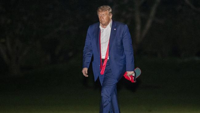 President Donald Trump walks on the South Lawn of the White House in Washington, early Sunday, June 21, 2020, after stepping off Marine One as he returns from a campaign rally in Tulsa, Okla. (AP Photo/Patrick Semansky)