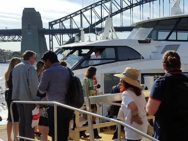 Commuters boarding a ferry. Picture: Brett Thomas