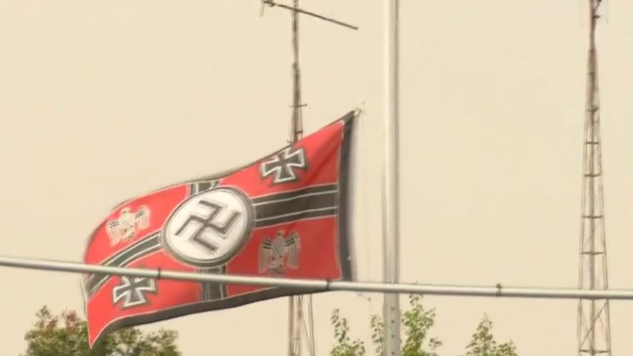 The Nazi flag was eventually taken down.