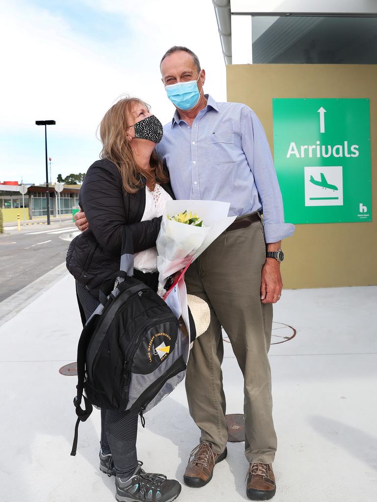 Colin Lester hugging wife Mairi Lester who arrived home. Tasmanian borders open to high risk states once again. Picture: Nikki Davis-Jones