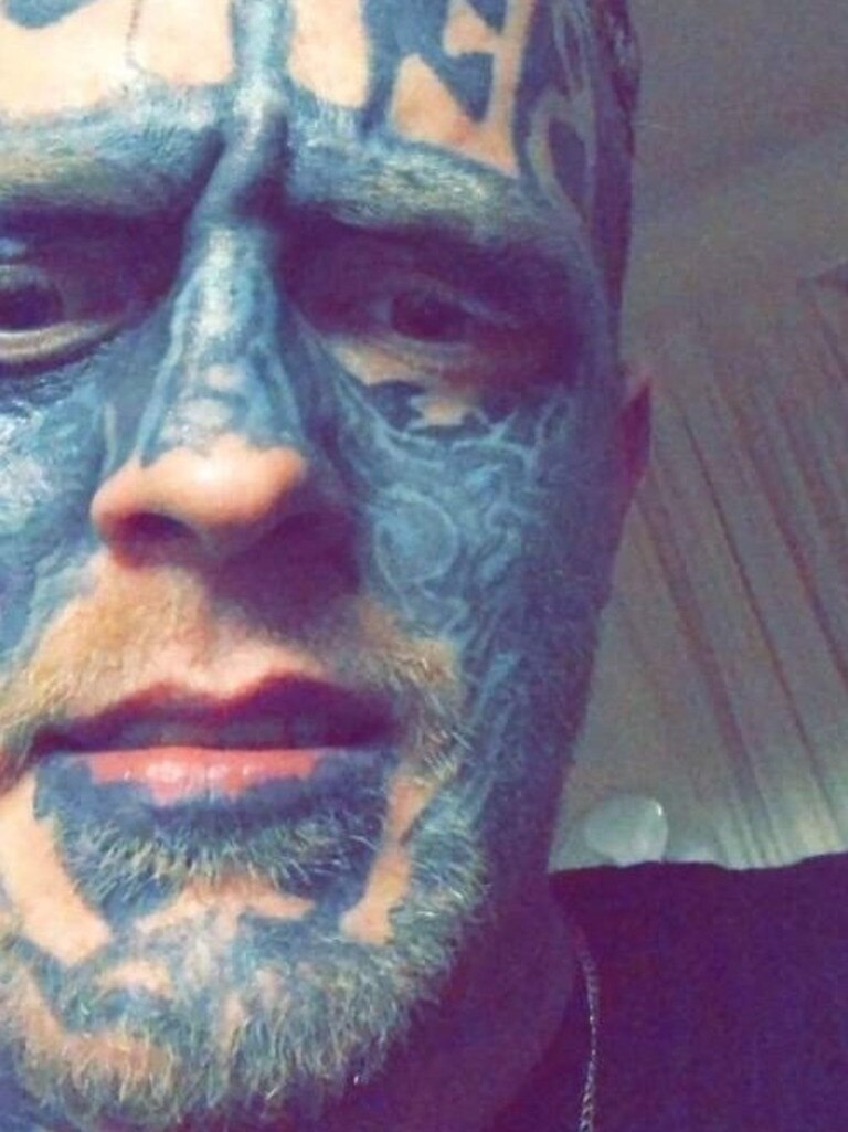 Bloke with bizarre tattoos wanted by police - and people are all