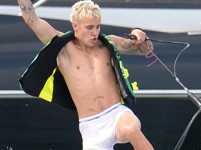 WEB ONLY - ABSOLUTELY NO PRINT!!!! Credit INF EXCLUSIVE TO INF. July 3, 2016: Justin Bieber rides a jetboard in his Calvin Klein underwear during 4th of July weekend in Miami Beach, Florida. Also joining Bieber during his day on the water was his friend Ryan Good and girlfriend Ashley Benson. Mandatory Credit: INFphoto/Fameflynet Ref: infusmi-20/21/usla-23