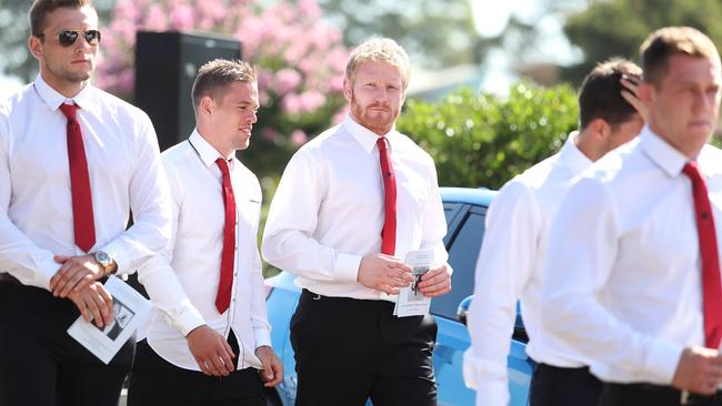 St George Dragons players pay their respects. Picture: Brett Costello