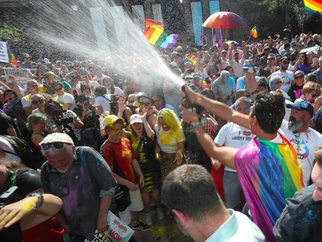 The crowd react to the same-sex marriage postal survey Yes result in front of the State library of Victoria in Melbourne, Wednesday, November 15, 2017. Picture: AAP Image/David Crosling