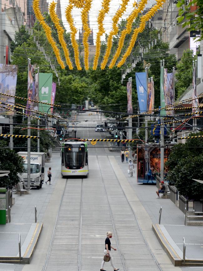 People are slowly returning to Bourke Street Mall. Picture: Andrew Henshaw