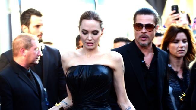 A red carpet crasher rushed at Brad Pitt at the Maleficent premiere in Hollywood.