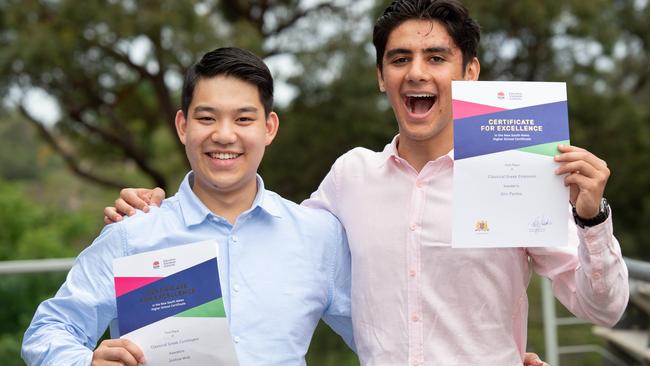 Joshua Mok and Eric Pavlou receive their certificates for excellence HSC presented at UNSW. Picture: AAP Image / Monique Harmer