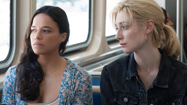 Michelle Rodriguez and Elizabeth Debicki in a scene from film Widows Twentieth Century Fox