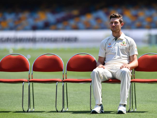 Cameron Bancroft is seen waiting for team mates before the team photo during the Australian Men's cricket team training session at the Gabba in Brisbane, Tuesday, November 19, 2019. Australia will take on Pakistan in the first test at the Gabba from Thursday.  (AAP Image/Darren England) NO ARCHIVING