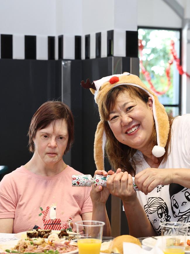 The Cairns Community Christmas Lunch was served up on Christmas Day at St Augustine's College, totally free of charge, thanks to the generosity of Cairns businesses, personal donations and a small army of volunteers. Karen Bromfield and Mihiko Miller enjoy the free charity lunch organised by the Cairns Community Christmas Lunch. Picture: Brendan Radke