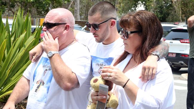 The funeral of stabbing victim Jack Beasley was held at Southport Church of Christ. Pictured is Jack's older brother Mitch with parents Brett and Belinda Beasley on December 23. Picture: AAP Image/Richard Gosling