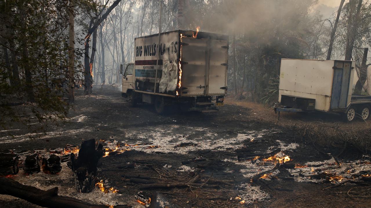 Destroyed trucks that were caught in a blaze at Possum Brush. Picture: AAP