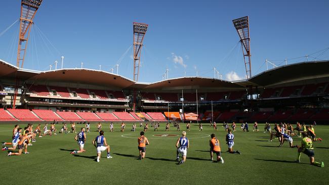 Over the weekend, AFL players, coaches and umpires took a knee in support of the Black Lives Matter movement. Picture: Matt King/AFL/Getty