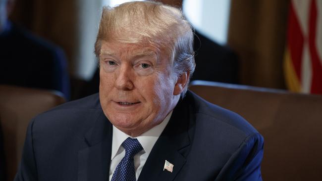 President Donald Trump speaks during a cabinet meeting at the White House early today in Washington.