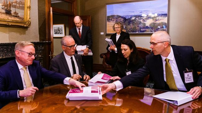 In June 2023, NSW Legislative Assembly speaker Greg Piper, second-left, and Upper House president Ben Franklin, left, read the ICAC’s report. Picture: James Brickwood