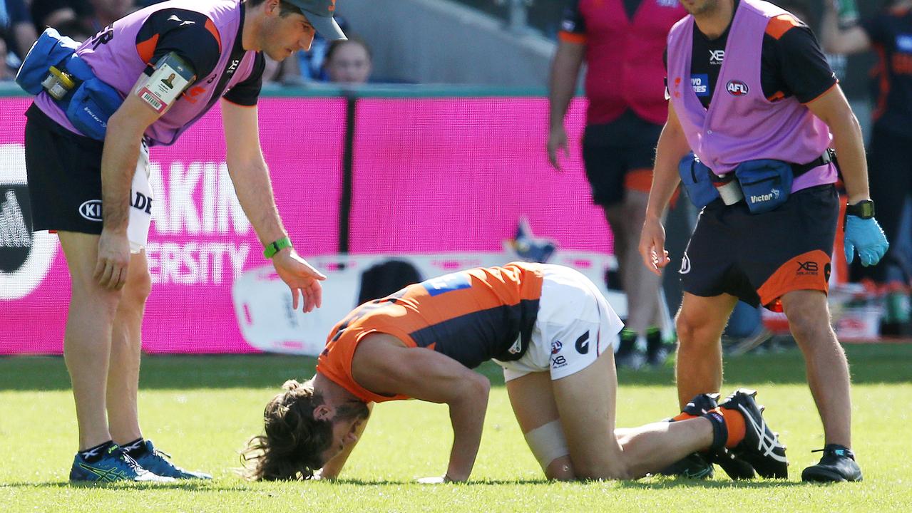 Callan Ward after suffering a serious knee injury against Geelong. Picture: Michael Klein