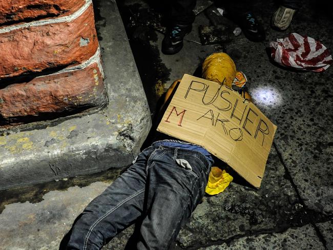 An executed alleged drug dealer with his head wrapped in tape