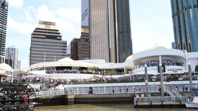 October 2011: The crowd at Eagle Street Pier gathers to watch Her Majesty The Queen, Elizabeth II, sail down the Brisbane River. Picture: Jodie Richter